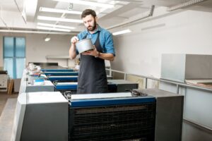 Typographer with paint at the manufacturing